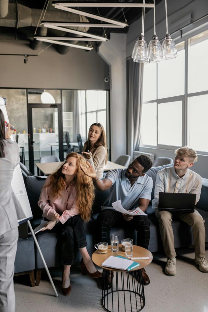 Diverse team engaging in a collaborative meeting in a modern office setting.